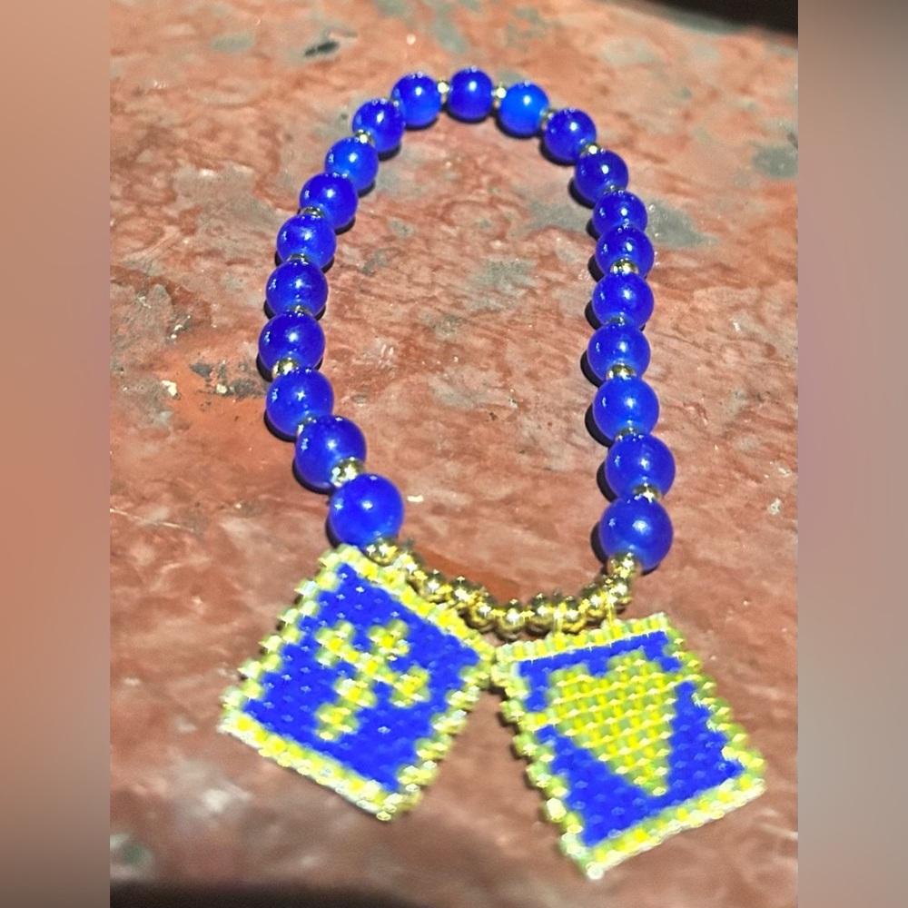 Blue and Gold Beaded Bracelet with Cross and Heart Charms